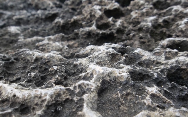 An aggressively textured rock formed from low-temperature lava. (2014)