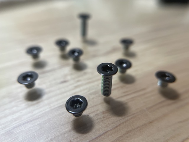 Floating in midair?  No, these screws were carefully stood up on a clear pane of glass. (2024)