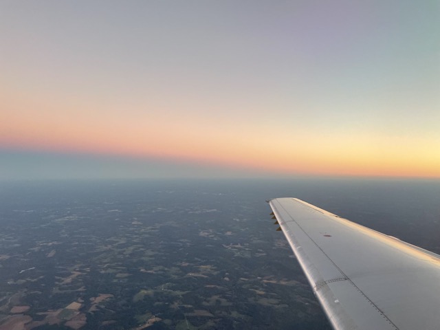 Twilight on a flight heading northeast.  With the sun beneath the horizon, Earth's shadow reaches upward into the sky. (2025)